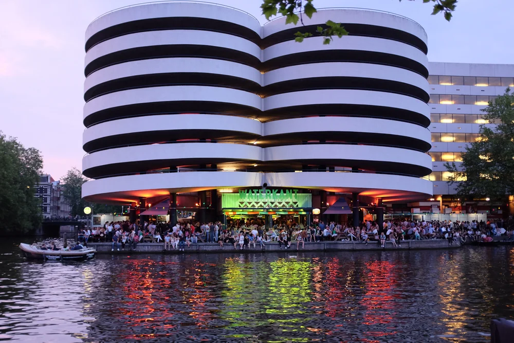Waterkant's waterside terrace at dusk, Amsterdam